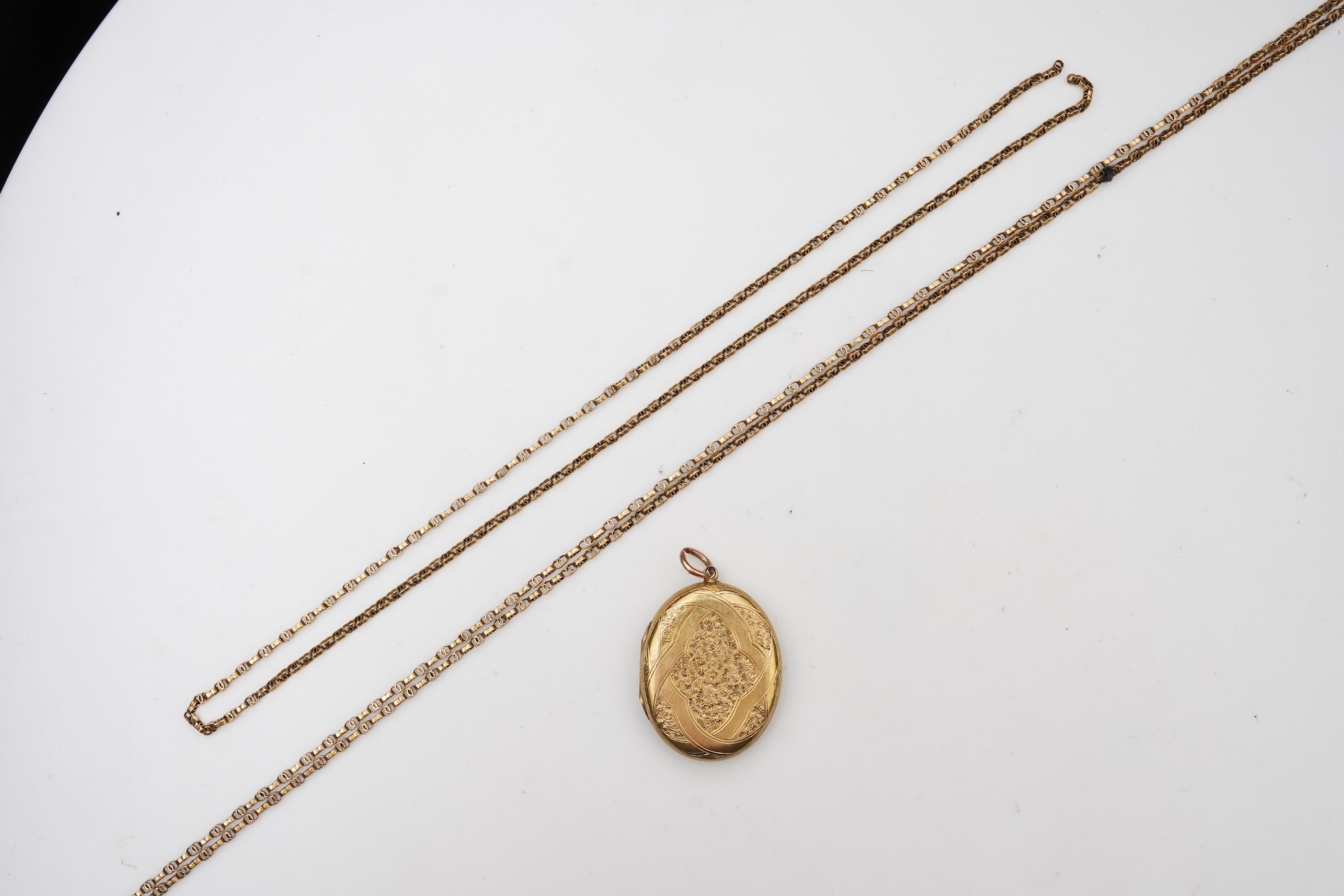 A Victorian gold locket and chain, late 19th century